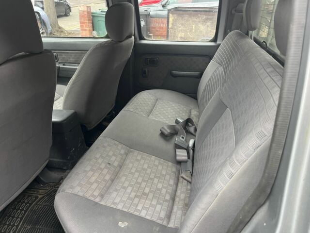 Сірий Ніссан Навара, об'ємом двигуна 2.5 л та пробігом 133 тис. км за 5600 $, фото 22 на Automoto.ua