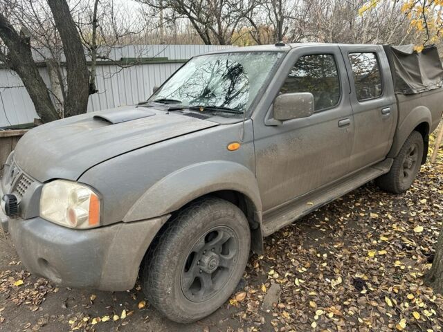 Серый Ниссан Навара, объемом двигателя 2.5 л и пробегом 197 тыс. км за 5100 $, фото 2 на Automoto.ua