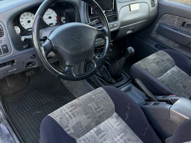 Синий Ниссан Навара, объемом двигателя 2.5 л и пробегом 250 тыс. км за 4200 $, фото 4 на Automoto.ua