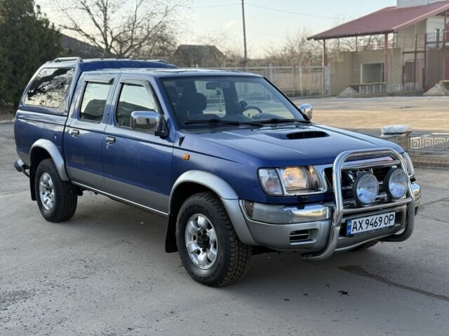 Синий Ниссан Навара, объемом двигателя 2.5 л и пробегом 250 тыс. км за 4200 $, фото 3 на Automoto.ua
