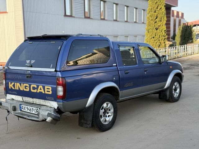 Синий Ниссан Навара, объемом двигателя 2.5 л и пробегом 250 тыс. км за 4200 $, фото 2 на Automoto.ua