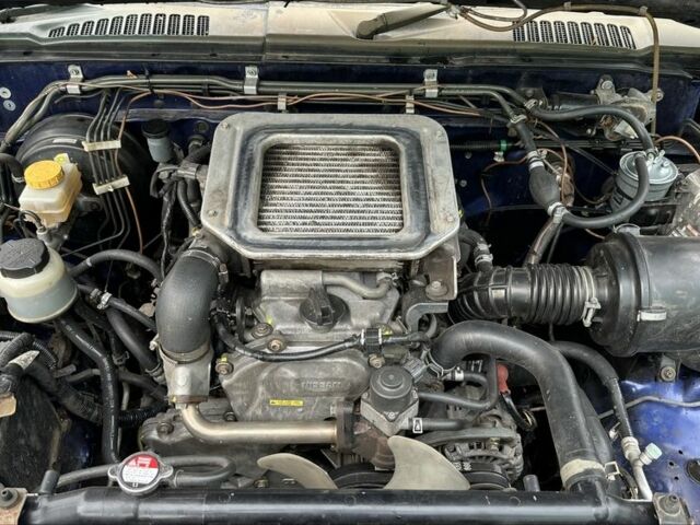 Синий Ниссан Навара, объемом двигателя 2.5 л и пробегом 281 тыс. км за 4000 $, фото 7 на Automoto.ua