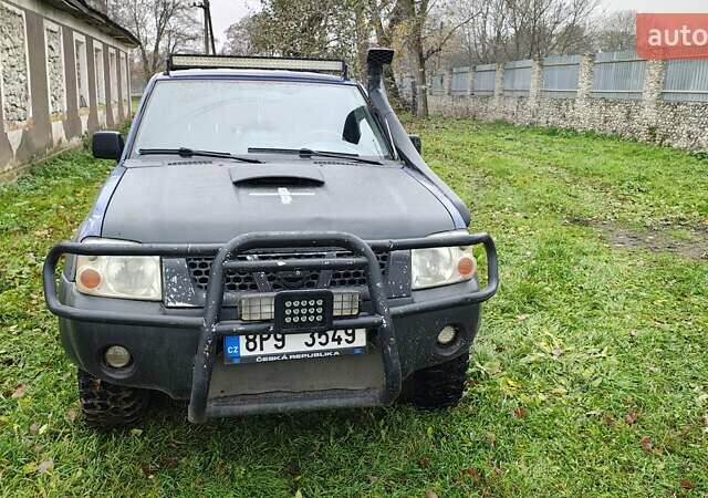 Синій Ніссан Навара, об'ємом двигуна 2.5 л та пробігом 316 тис. км за 7246 $, фото 4 на Automoto.ua