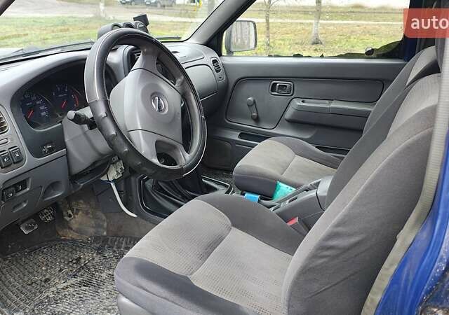 Синій Ніссан Навара, об'ємом двигуна 2.5 л та пробігом 316 тис. км за 7246 $, фото 6 на Automoto.ua