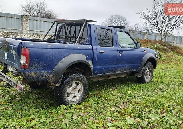 Синій Ніссан Навара, об'ємом двигуна 2.5 л та пробігом 316 тис. км за 7246 $, фото 3 на Automoto.ua