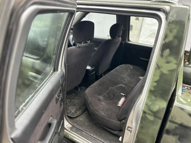 Зеленый Ниссан Навара, объемом двигателя 2.5 л и пробегом 110 тыс. км за 3750 $, фото 7 на Automoto.ua