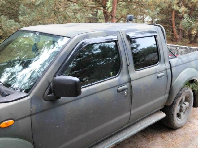 Зеленый Ниссан Навара, объемом двигателя 2.5 л и пробегом 261 тыс. км за 5001 $, фото 4 на Automoto.ua