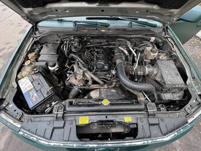 Зеленый Ниссан Навара, объемом двигателя 2.5 л и пробегом 250 тыс. км за 5999 $, фото 11 на Automoto.ua