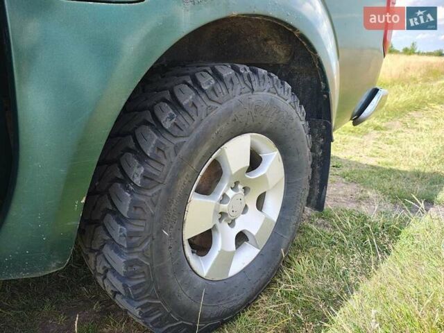 Зелений Ніссан Навара, об'ємом двигуна 2.49 л та пробігом 322 тис. км за 12800 $, фото 5 на Automoto.ua