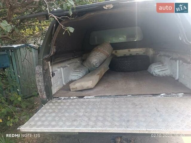 Зеленый Ниссан Навара, объемом двигателя 2.49 л и пробегом 298 тыс. км за 10000 $, фото 4 на Automoto.ua