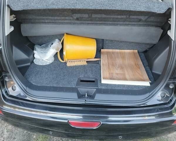 Черный Ниссан Ноут, объемом двигателя 1.4 л и пробегом 190 тыс. км за 6100 $, фото 6 на Automoto.ua