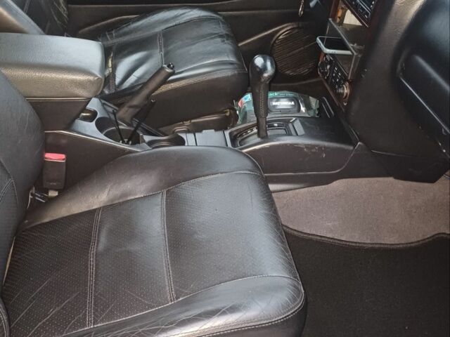 Черный Ниссан Патфайндер, объемом двигателя 3.5 л и пробегом 286 тыс. км за 4637 $, фото 4 на Automoto.ua