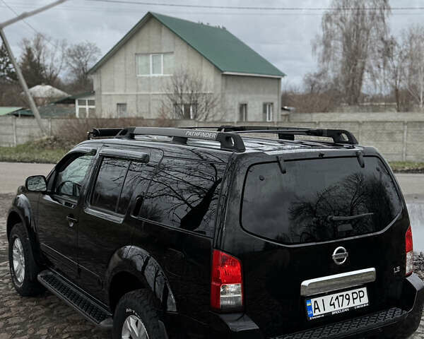 Черный Ниссан Патфайндер, объемом двигателя 4 л и пробегом 183 тыс. км за 9400 $, фото 4 на Automoto.ua
