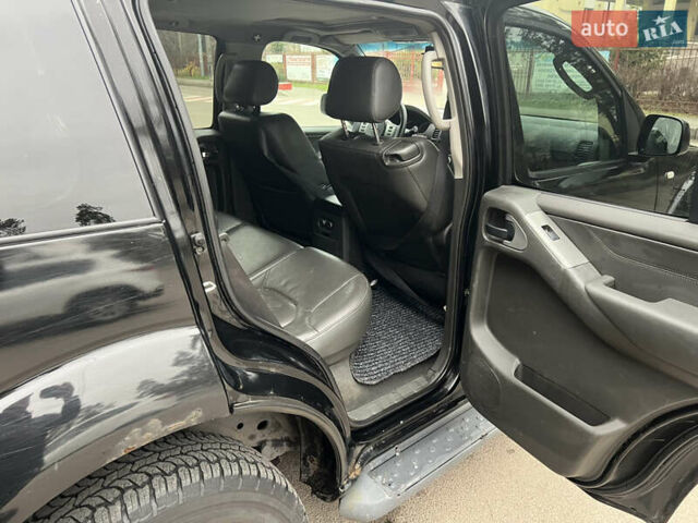 Черный Ниссан Патфайндер, объемом двигателя 2.49 л и пробегом 460 тыс. км за 7800 $, фото 7 на Automoto.ua