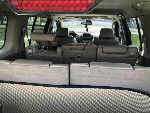 Черный Ниссан Патфайндер, объемом двигателя 4 л и пробегом 210 тыс. км за 10399 $, фото 7 на Automoto.ua