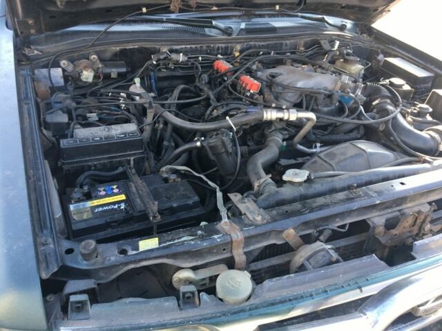 Зеленый Ниссан Патфайндер, объемом двигателя 3 л и пробегом 321 тыс. км за 4200 $, фото 7 на Automoto.ua