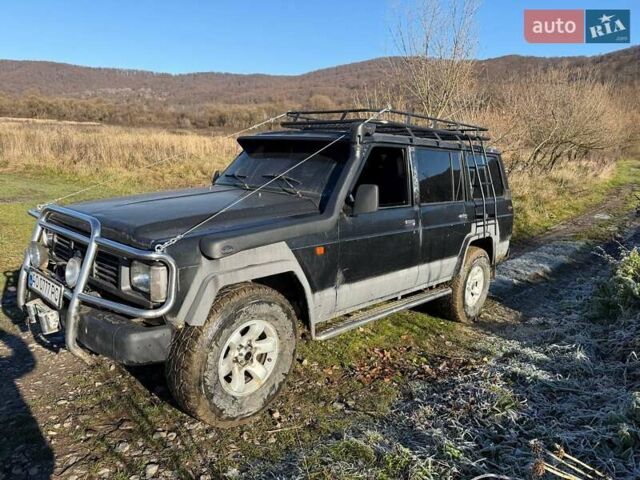 Черный Ниссан Патрол, объемом двигателя 2.8 л и пробегом 300 тыс. км за 5250 $, фото 4 на Automoto.ua