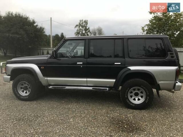 Чорний Ніссан Патрол, об'ємом двигуна 2.8 л та пробігом 306 тис. км за 12000 $, фото 2 на Automoto.ua