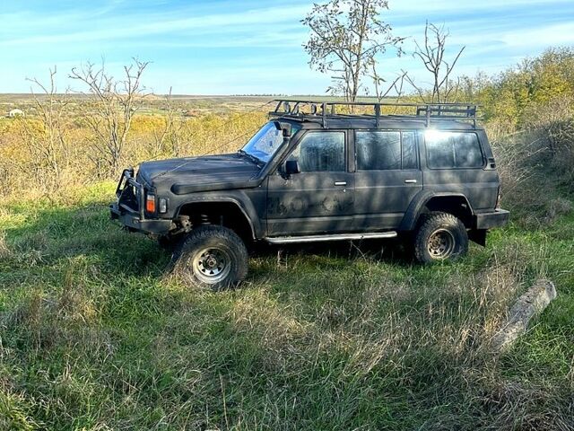 Чорний Ніссан Патрол, об'ємом двигуна 4.2 л та пробігом 0 тис. км за 7500 $, фото 1 на Automoto.ua