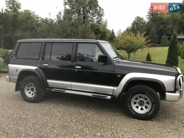 Чорний Ніссан Патрол, об'ємом двигуна 2.8 л та пробігом 306 тис. км за 12000 $, фото 1 на Automoto.ua