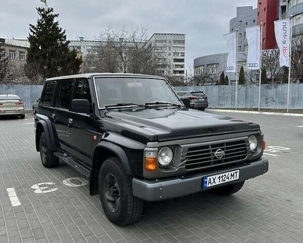 Чорний Ніссан Патрол, об'ємом двигуна 3 л та пробігом 200 тис. км за 12499 $, фото 3 на Automoto.ua