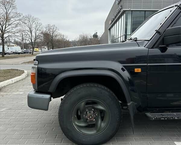 Чорний Ніссан Патрол, об'ємом двигуна 3 л та пробігом 200 тис. км за 12499 $, фото 12 на Automoto.ua