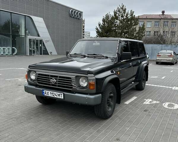 Чорний Ніссан Патрол, об'ємом двигуна 3 л та пробігом 200 тис. км за 12499 $, фото 1 на Automoto.ua