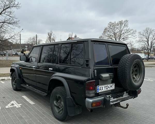 Чорний Ніссан Патрол, об'ємом двигуна 3 л та пробігом 200 тис. км за 12499 $, фото 9 на Automoto.ua