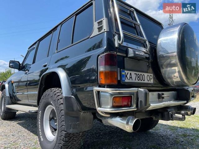 Черный Ниссан Патрол, объемом двигателя 2.8 л и пробегом 415 тыс. км за 12700 $, фото 4 на Automoto.ua