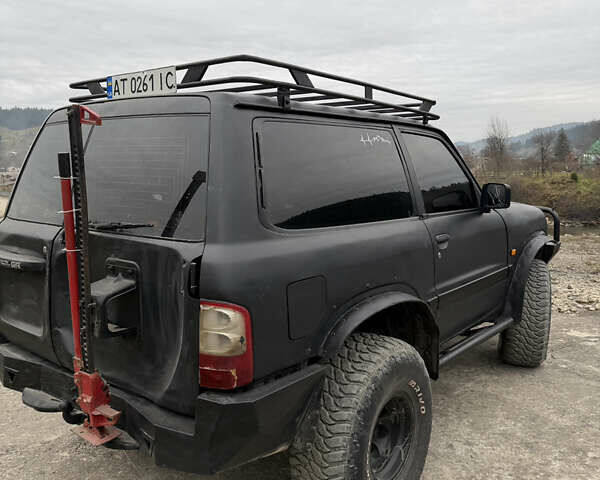 Чорний Ніссан Патрол, об'ємом двигуна 2.83 л та пробігом 307 тис. км за 14800 $, фото 4 на Automoto.ua