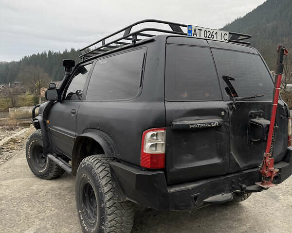 Чорний Ніссан Патрол, об'ємом двигуна 2.83 л та пробігом 307 тис. км за 14800 $, фото 5 на Automoto.ua