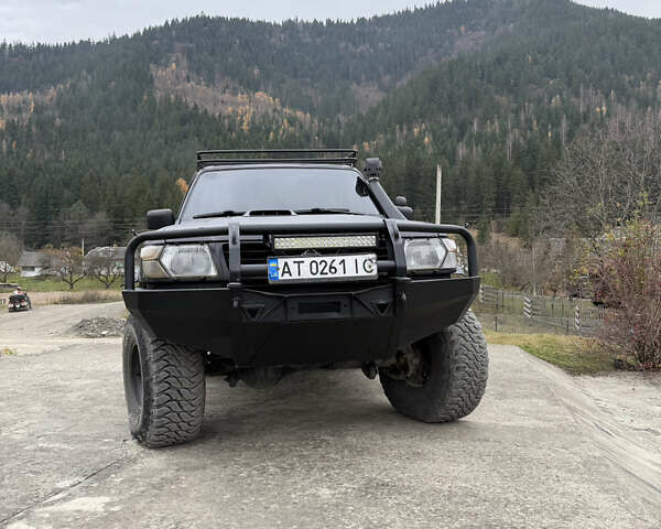Чорний Ніссан Патрол, об'ємом двигуна 2.83 л та пробігом 307 тис. км за 14800 $, фото 2 на Automoto.ua
