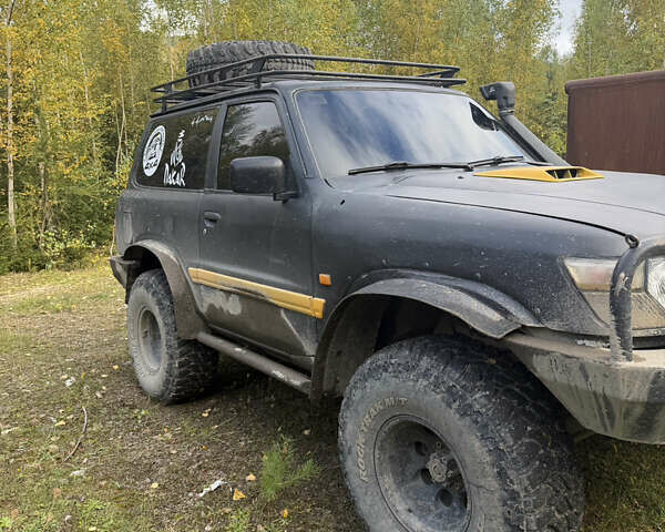 Черный Ниссан Патрол, объемом двигателя 2.83 л и пробегом 307 тыс. км за 15000 $, фото 7 на Automoto.ua