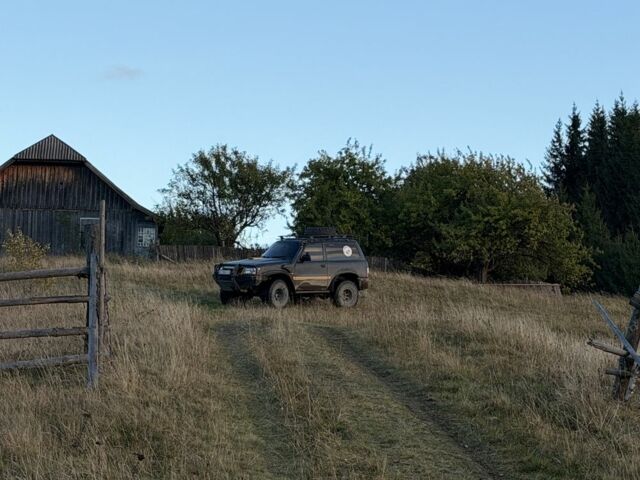 Черный Ниссан Патрол, объемом двигателя 2.8 л и пробегом 306 тыс. км за 15000 $, фото 11 на Automoto.ua