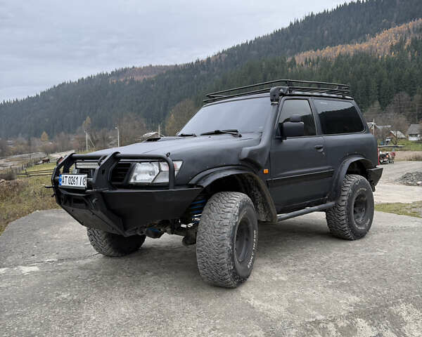 Чорний Ніссан Патрол, об'ємом двигуна 2.83 л та пробігом 307 тис. км за 14800 $, фото 1 на Automoto.ua
