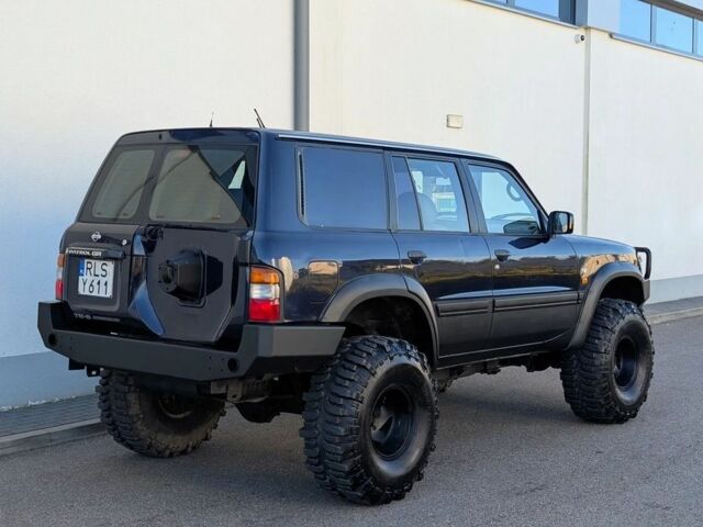 Черный Ниссан Патрол, объемом двигателя 2.8 л и пробегом 133 тыс. км за 2700 $, фото 3 на Automoto.ua