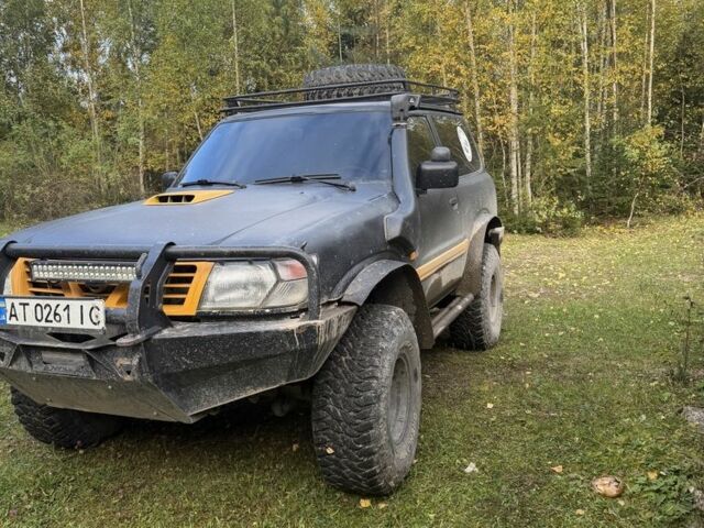 Черный Ниссан Патрол, объемом двигателя 2.8 л и пробегом 306 тыс. км за 15000 $, фото 4 на Automoto.ua