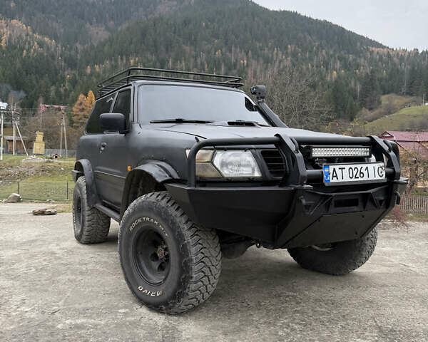 Чорний Ніссан Патрол, об'ємом двигуна 2.83 л та пробігом 307 тис. км за 14800 $, фото 3 на Automoto.ua