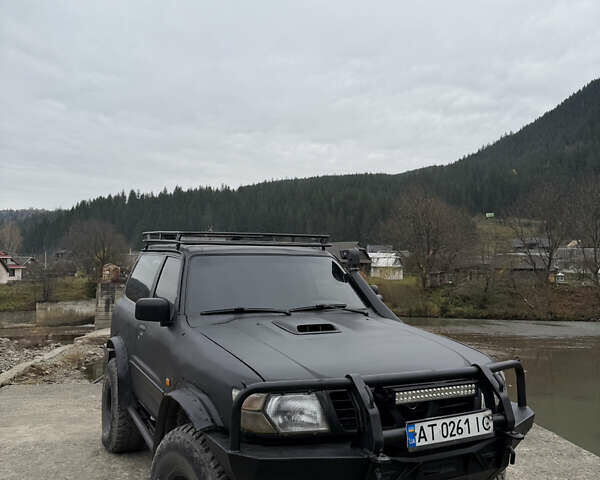 Чорний Ніссан Патрол, об'ємом двигуна 2.83 л та пробігом 307 тис. км за 14800 $, фото 11 на Automoto.ua