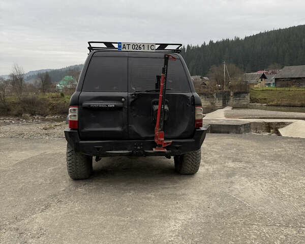 Чорний Ніссан Патрол, об'ємом двигуна 2.83 л та пробігом 307 тис. км за 14800 $, фото 7 на Automoto.ua