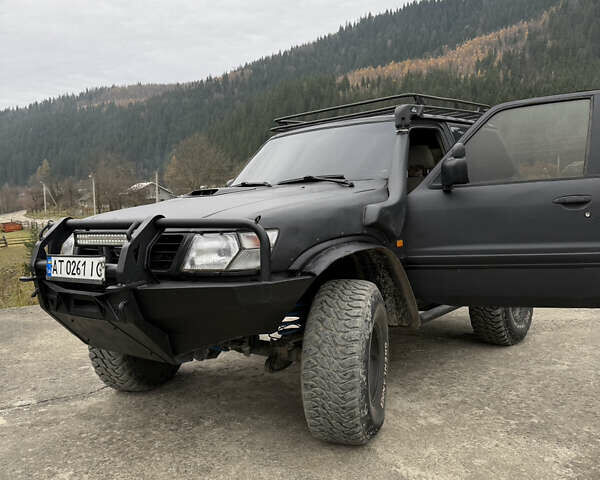 Чорний Ніссан Патрол, об'ємом двигуна 2.83 л та пробігом 307 тис. км за 14800 $, фото 10 на Automoto.ua