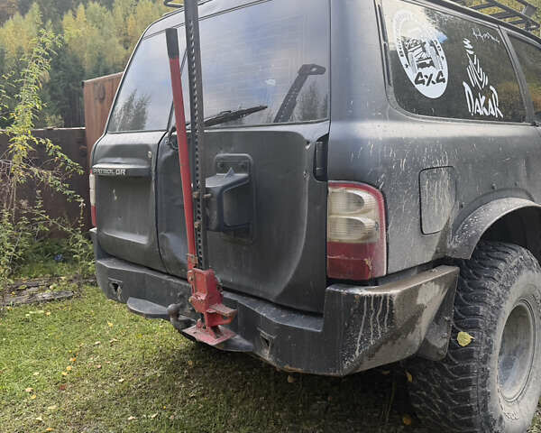 Черный Ниссан Патрол, объемом двигателя 2.83 л и пробегом 307 тыс. км за 15000 $, фото 5 на Automoto.ua