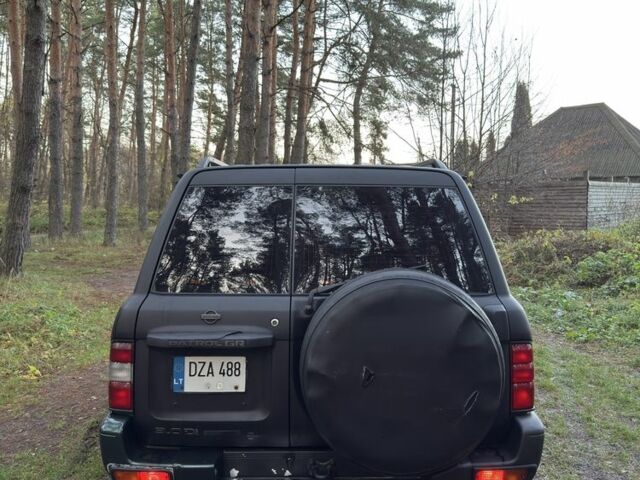 Черный Ниссан Патрол, объемом двигателя 3 л и пробегом 251 тыс. км за 9000 $, фото 5 на Automoto.ua