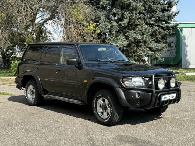 Чорний Ніссан Патрол, об'ємом двигуна 0 л та пробігом 200 тис. км за 5936 $, фото 4 на Automoto.ua