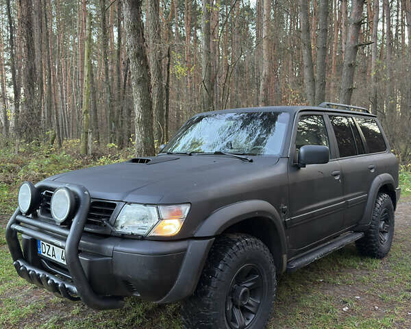 Черный Ниссан Патрол, объемом двигателя 3 л и пробегом 251 тыс. км за 9000 $, фото 2 на Automoto.ua