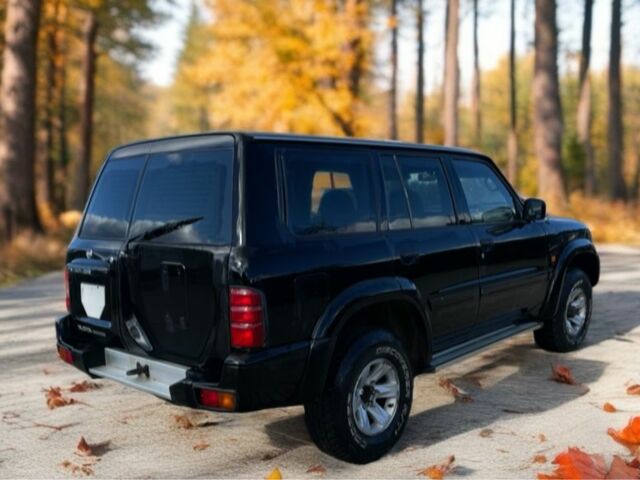 Чорний Ніссан Патрол, об'ємом двигуна 3 л та пробігом 350 тис. км за 7999 $, фото 2 на Automoto.ua