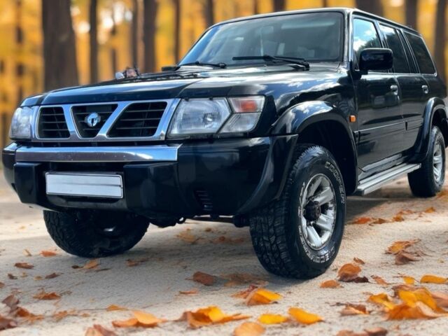 Чорний Ніссан Патрол, об'ємом двигуна 3 л та пробігом 350 тис. км за 7999 $, фото 5 на Automoto.ua