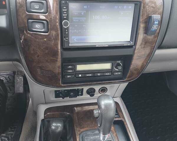 Черный Ниссан Патрол, объемом двигателя 4.8 л и пробегом 396 тыс. км за 37000 $, фото 1 на Automoto.ua