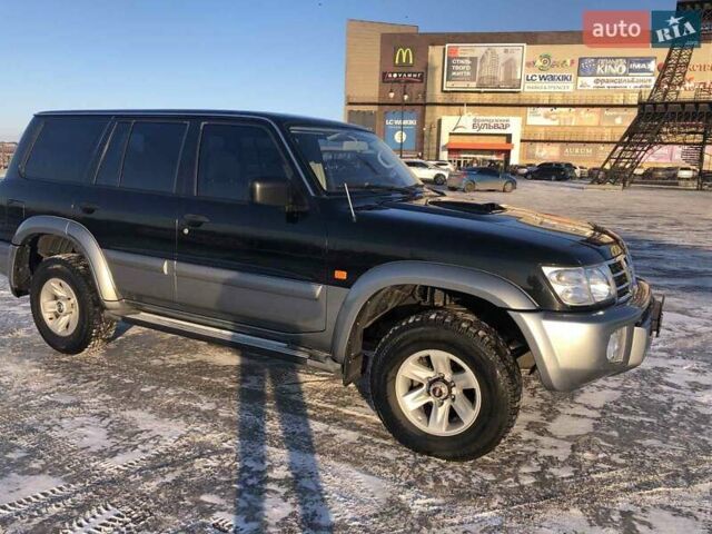Черный Ниссан Патрол, объемом двигателя 2.95 л и пробегом 290 тыс. км за 17000 $, фото 8 на Automoto.ua