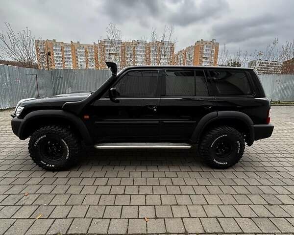 Черный Ниссан Патрол, объемом двигателя 3 л и пробегом 276 тыс. км за 22500 $, фото 4 на Automoto.ua